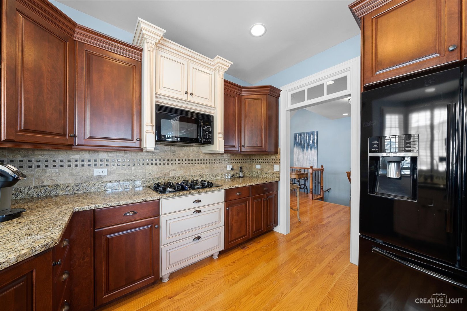 3509 Ridge Pointe Drive Geneva, IL 60134 - Photo 10 of 39 a kitchen with granite countertop stainless steel appliances and wooden cabinets