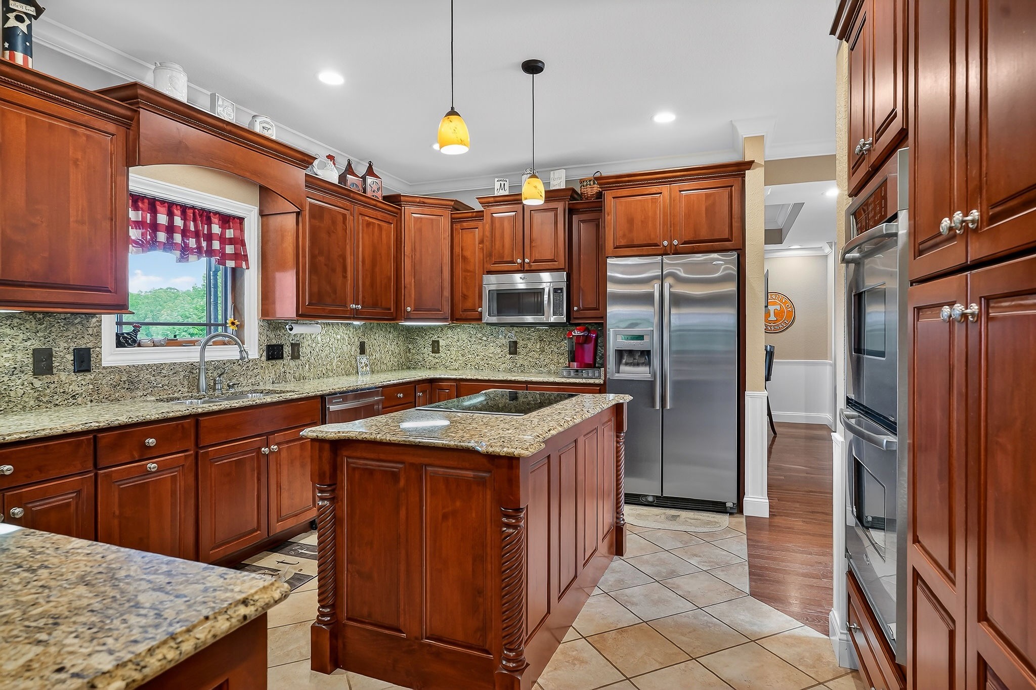 933 John Henry Lewis Road Dunlap, TN 37327 - Photo 35 of 100 a kitchen with stainless steel appliances granite countertop a stove a sink and a refrigerator