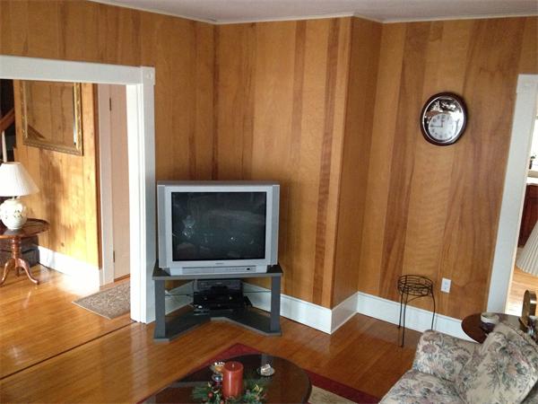 348 River Road Andover, MA 01810 - Photo 6 of 22 a living room with a couch and a flat screen tv