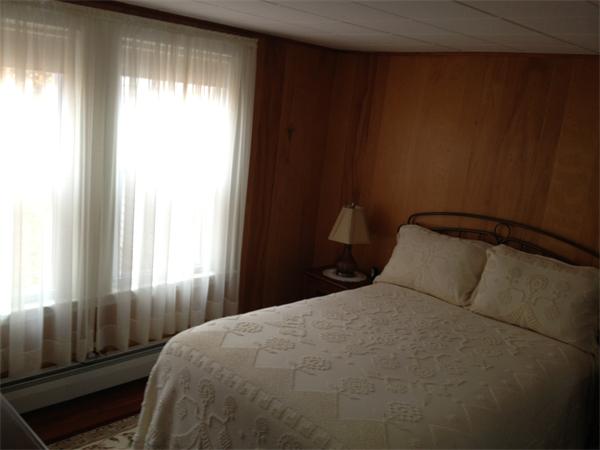 348 River Road Andover, MA 01810 - Photo 8 of 22 a bedroom with a bed and a window