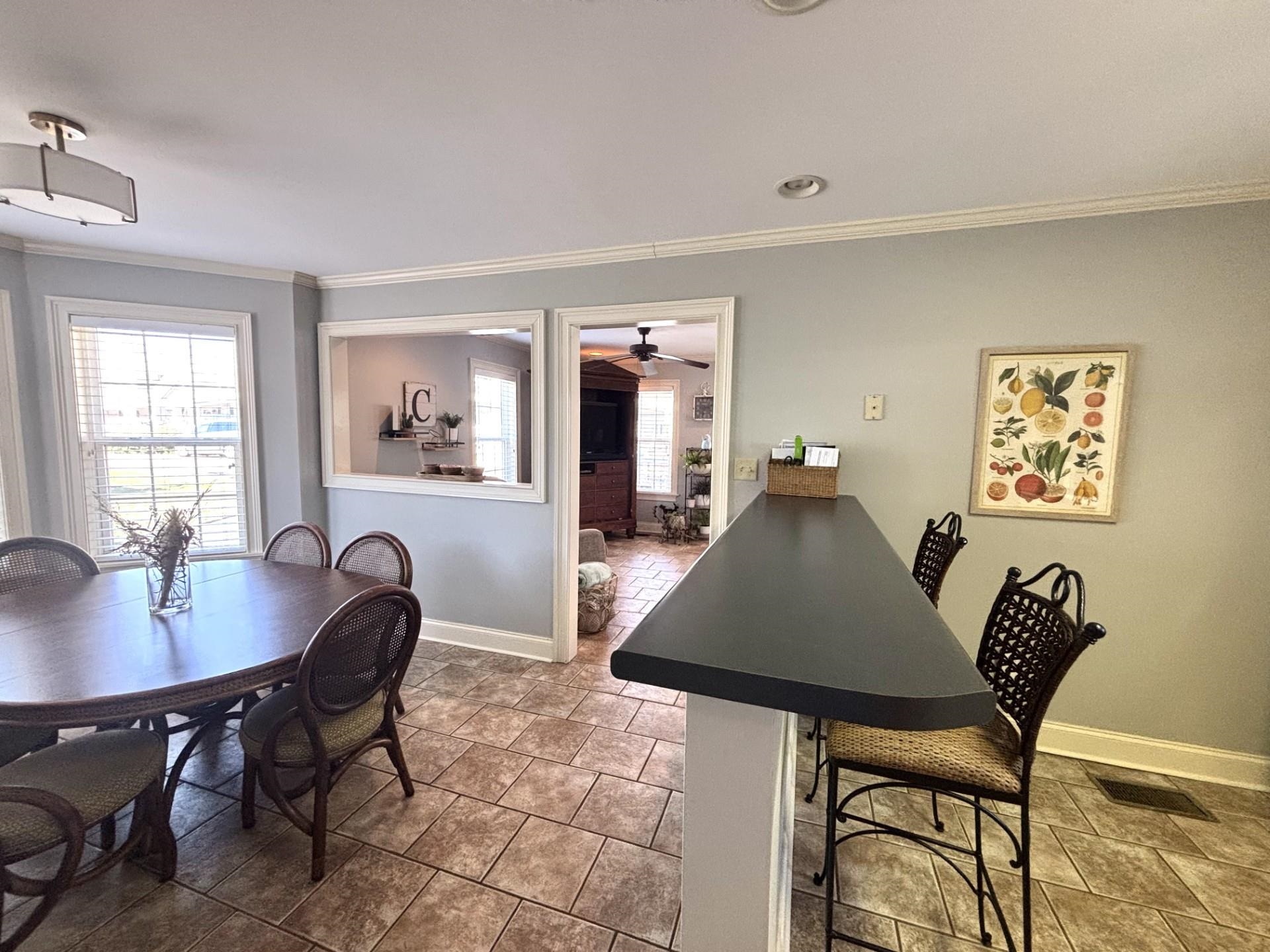 55 Cody Cove Iuka, MS 38852 - Photo 8 of 19 Dining area with baseboards, visible vents, and crown molding