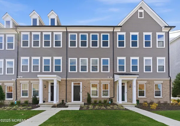 front view of a building with a yard