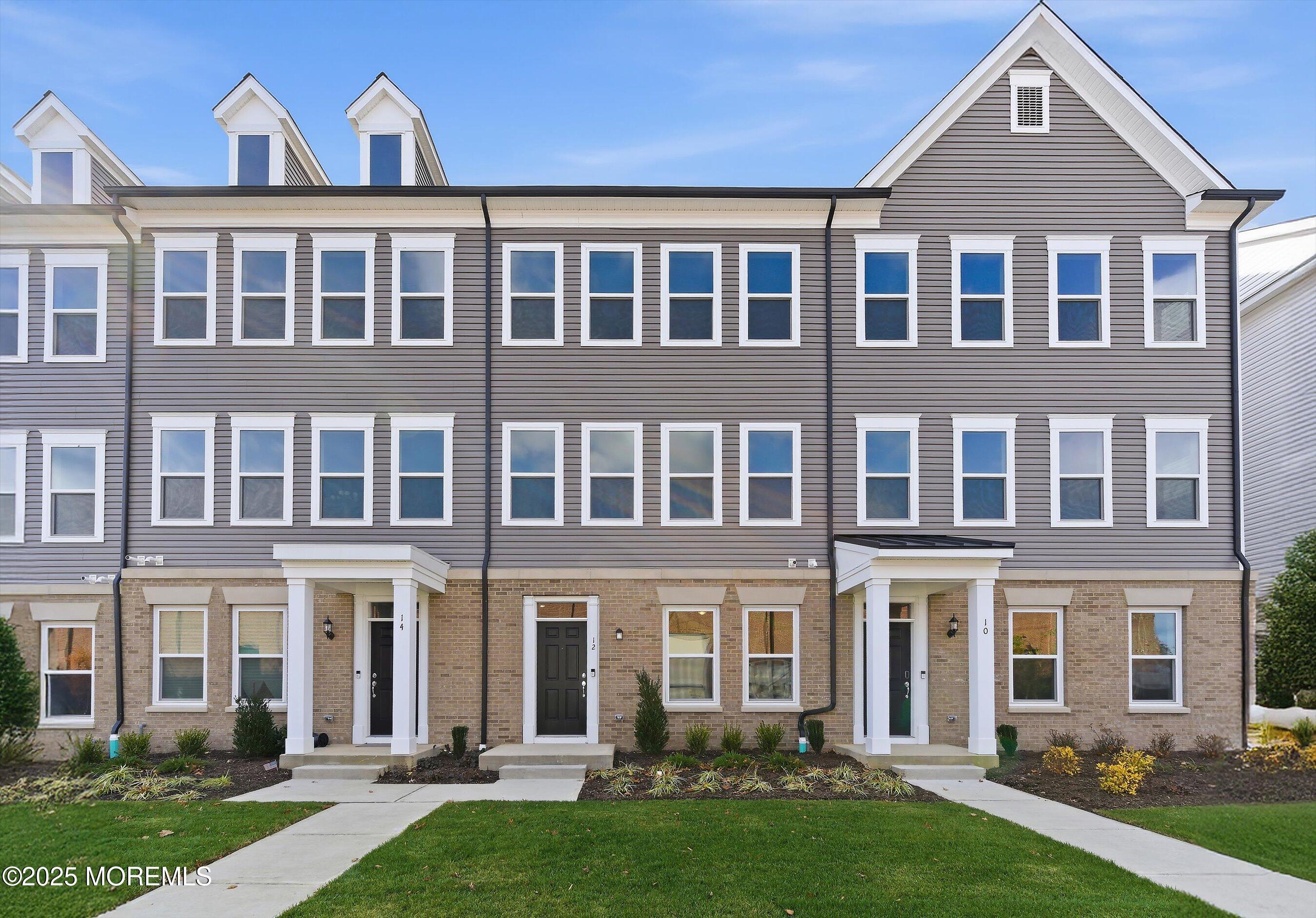 front view of a building with a yard