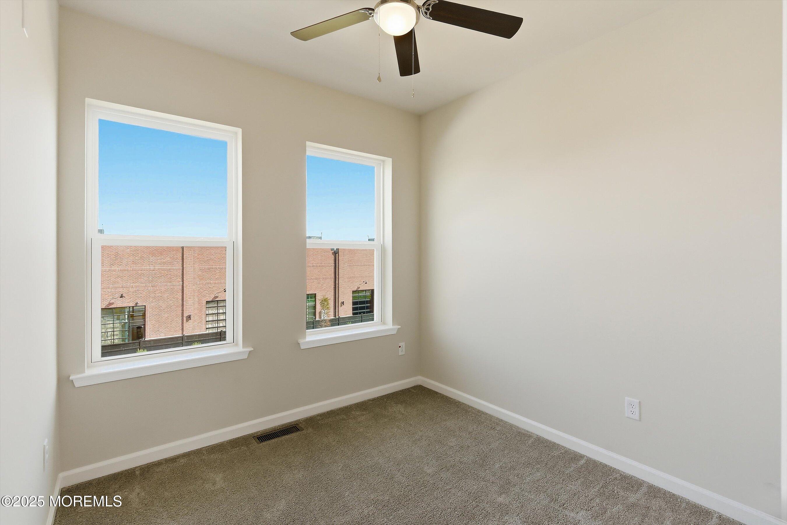 12 Barton Avenue Oceanport, NJ 07757 - Photo 15 of 22 an empty room with chandelier fan