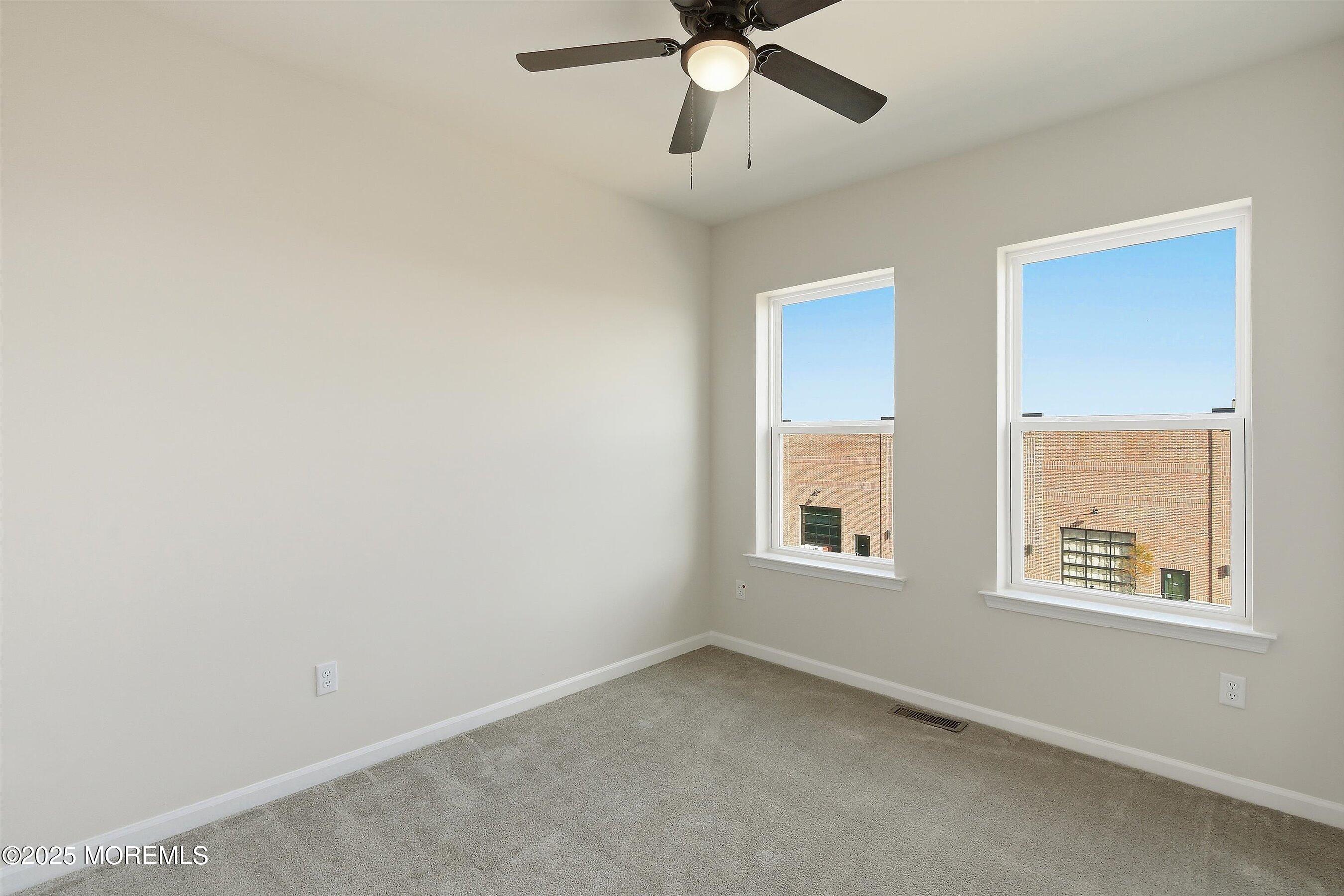 12 Barton Avenue Oceanport, NJ 07757 - Photo 16 of 22 an empty room with windows and fan