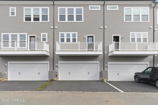 a front view of a building with many windows