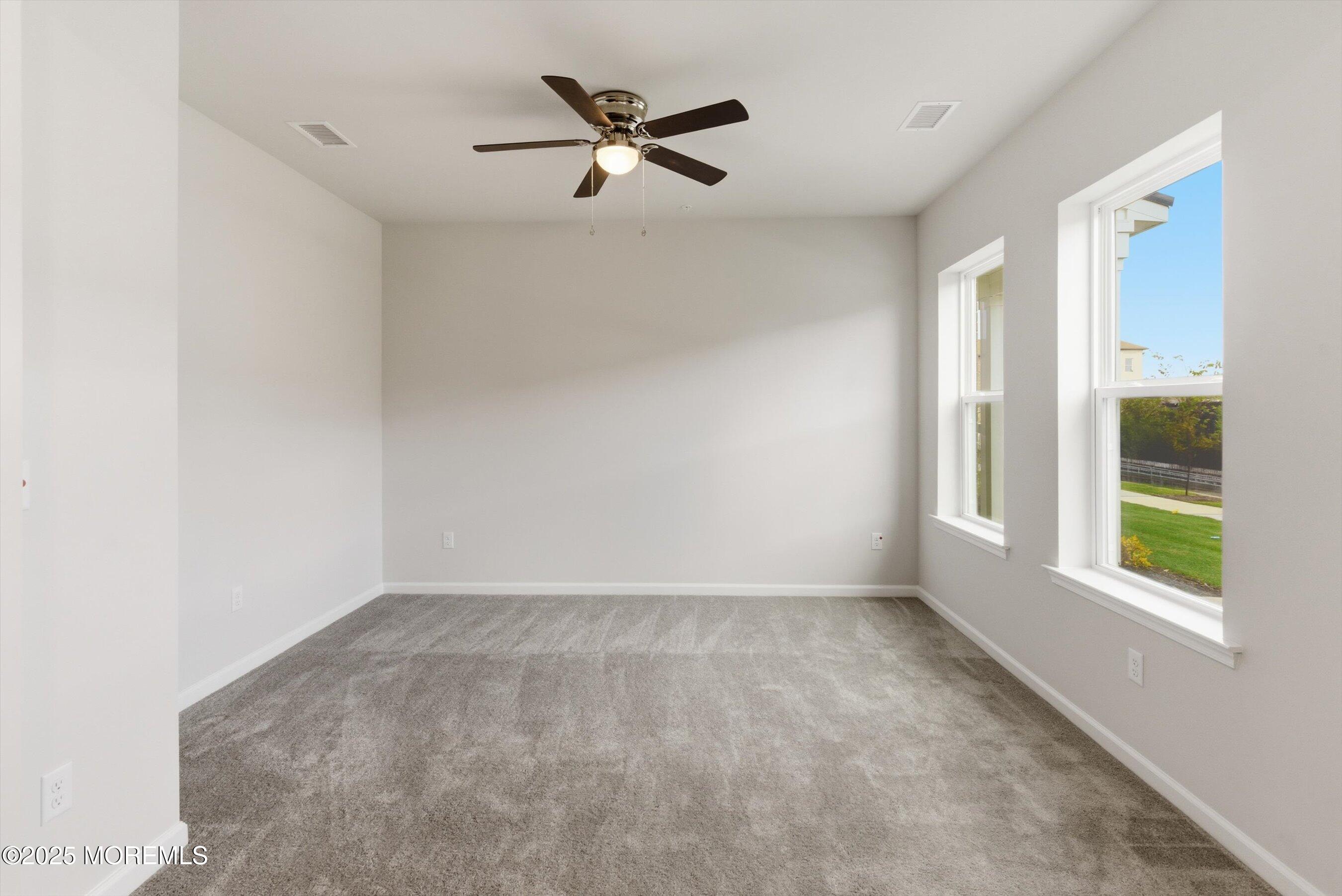12 Barton Avenue Oceanport, NJ 07757 - Photo 3 of 22 a view of a livingroom with a ceiling fan and window