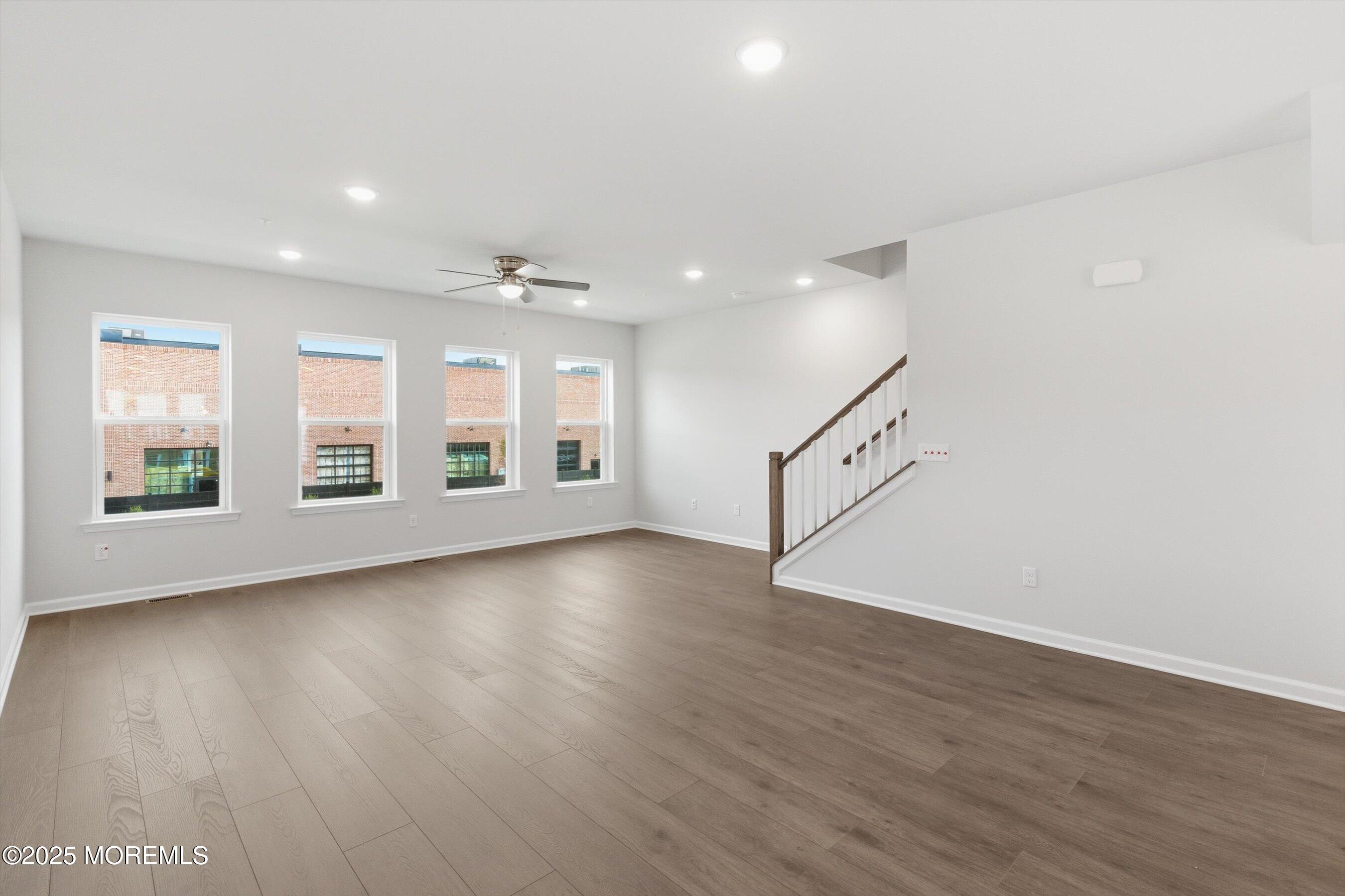 12 Barton Avenue Oceanport, NJ 07757 - Photo 9 of 22 an empty room with wooden floor and windows