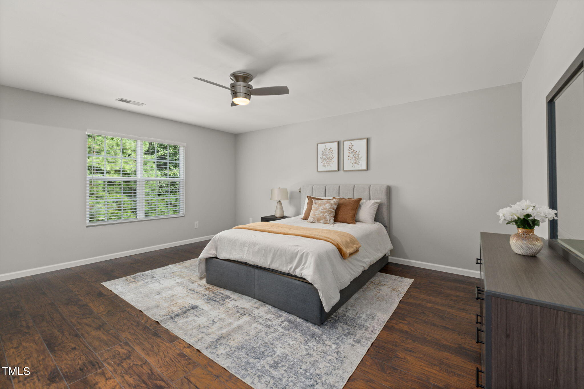 2701 Skybrook Lane Durham, NC 27703 - Photo 12 of 24 a bedroom with a large bed chandelier and a window