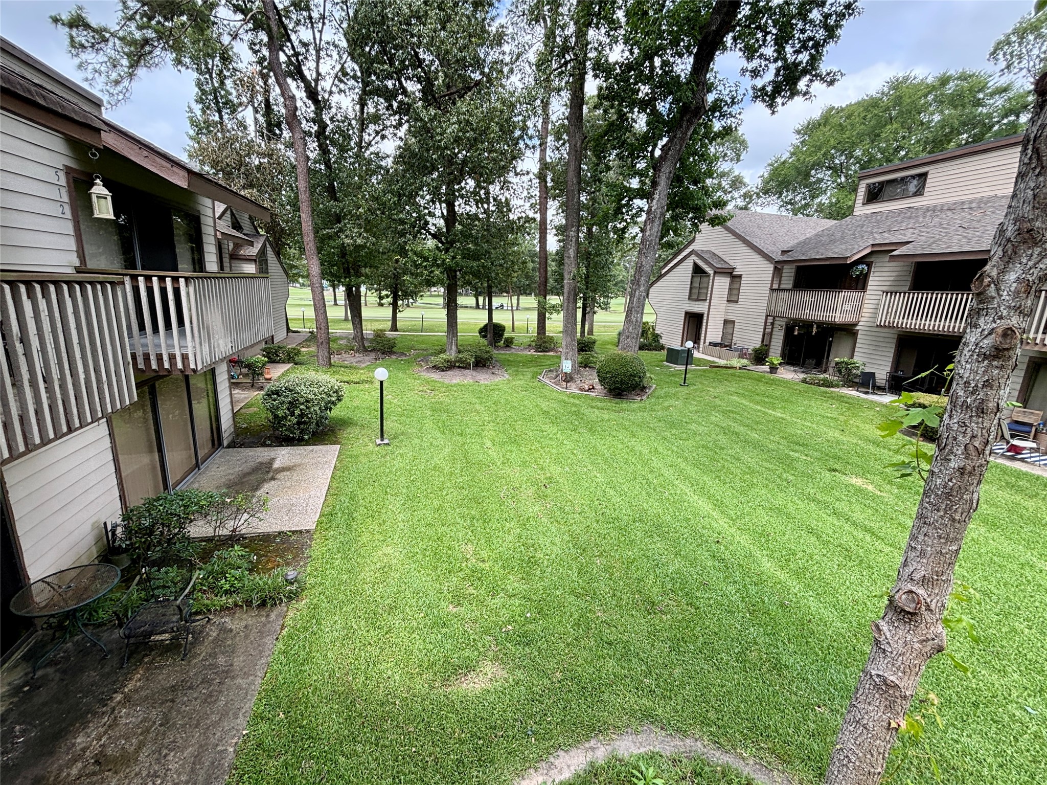 12900 Walden Road, Unit 508E Montgomery, TX 77356 - Photo 20 of 25 a view of a house with backyard and sitting area