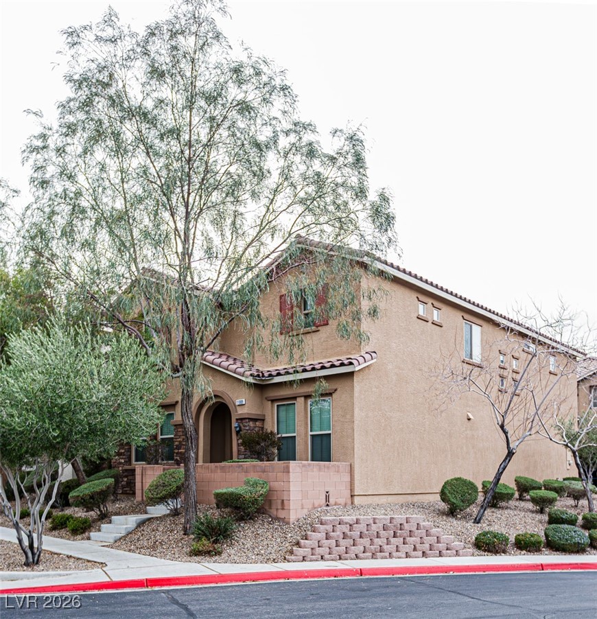 11009 Ketchikan Street Las Vegas, NV 89179 - Photo 2 of 59 Mediterranean / spanish home featuring stucco siding and a tile roof