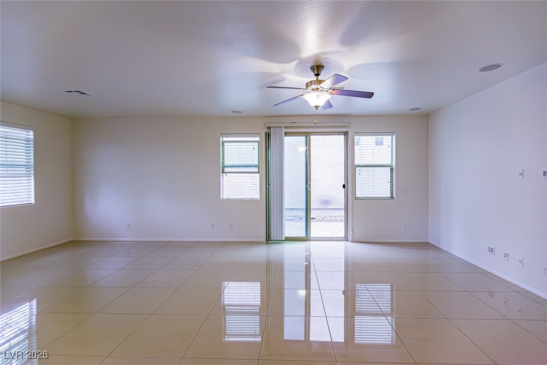 11009 Ketchikan Street Las Vegas, NV 89179 - Photo 8 of 59 Unfurnished room with light tile patterned flooring and ceiling fan