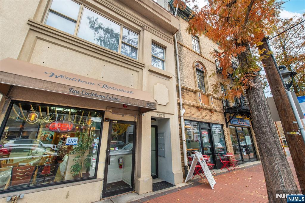 1878 Springfield Avenue, Unit 2B Maplewood, NJ 07040 - Photo 1 of 15 a view of a building with a lot of people