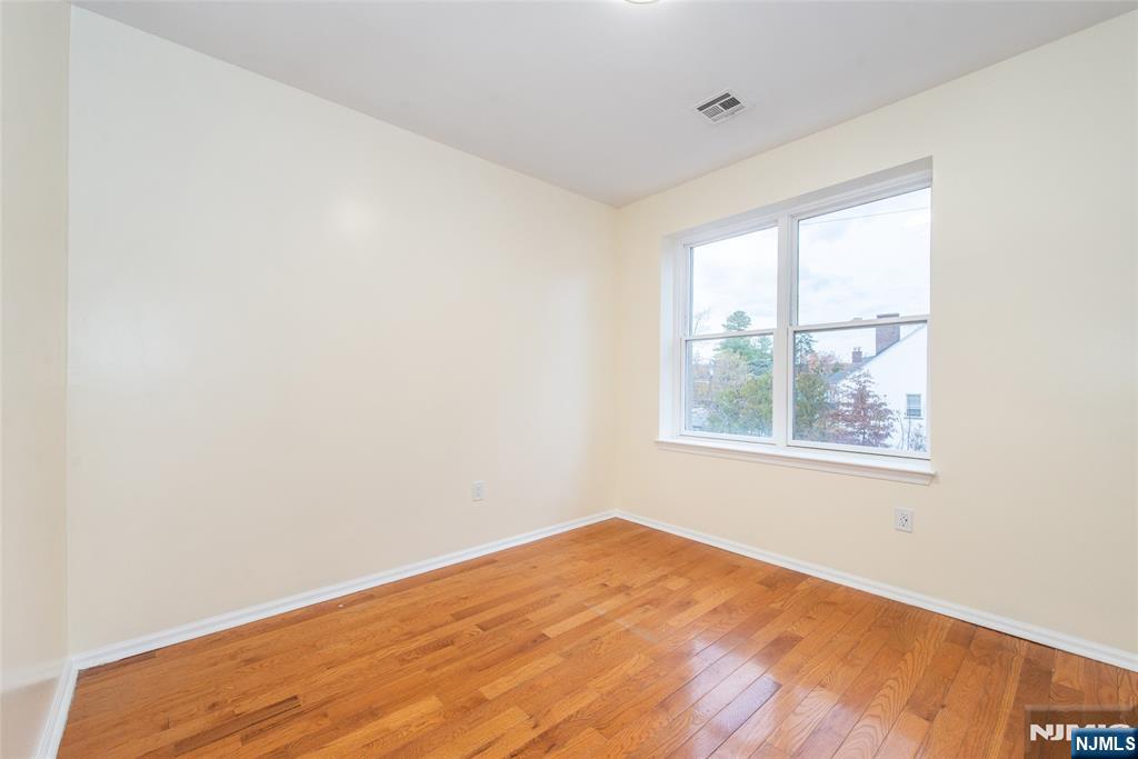 1878 Springfield Avenue, Unit 2B Maplewood, NJ 07040 - Photo 13 of 15 a view of an empty room with a window