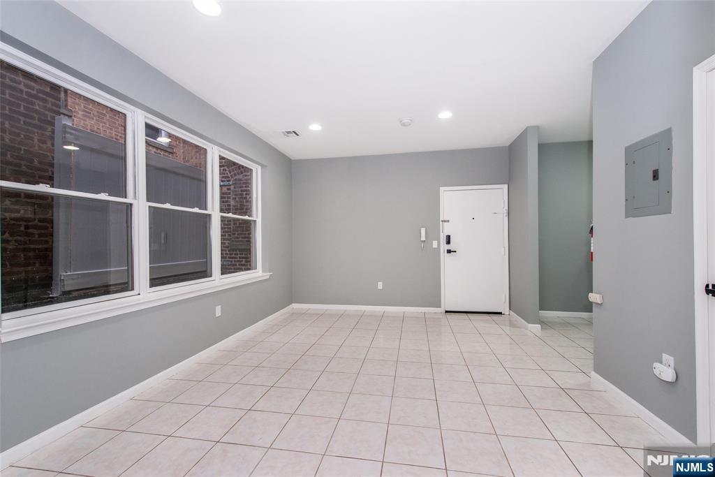 1878 Springfield Avenue, Unit 2B Maplewood, NJ 07040 - Photo 7 of 15 a view of an empty room with a window