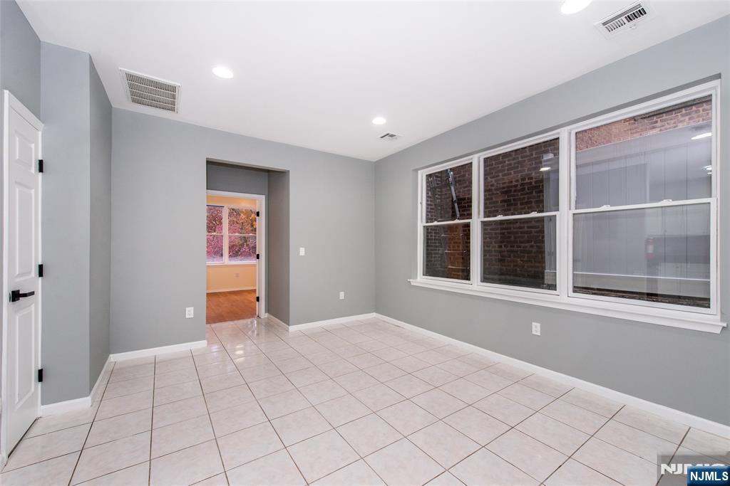 1878 Springfield Avenue, Unit 2B Maplewood, NJ 07040 - Photo 8 of 15 a view of an empty room with window