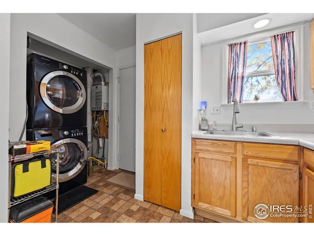 a bathroom with a sink a mirror and a window