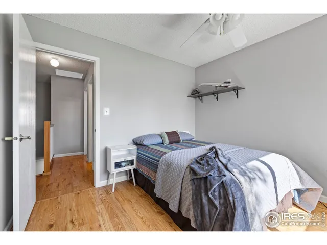 a bedroom with a bed and a view of bathroom