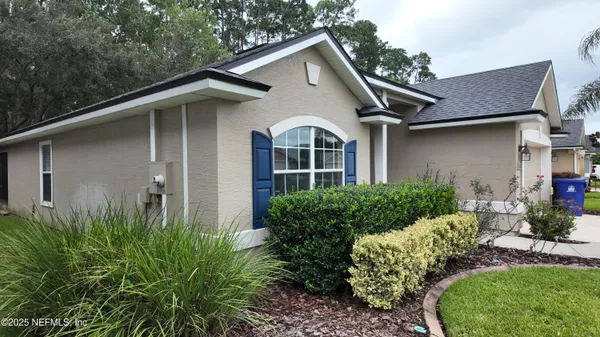 a front view of a house with garden