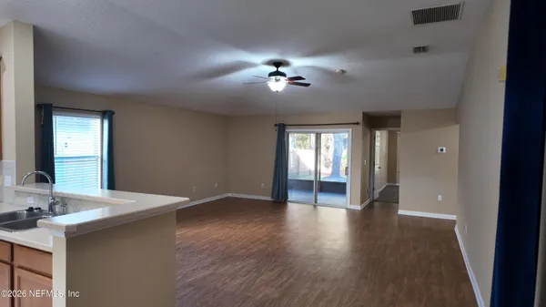 a view of an empty room with a bathroom