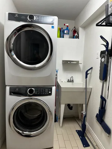 a bathroom with a sink a toilet and a shower