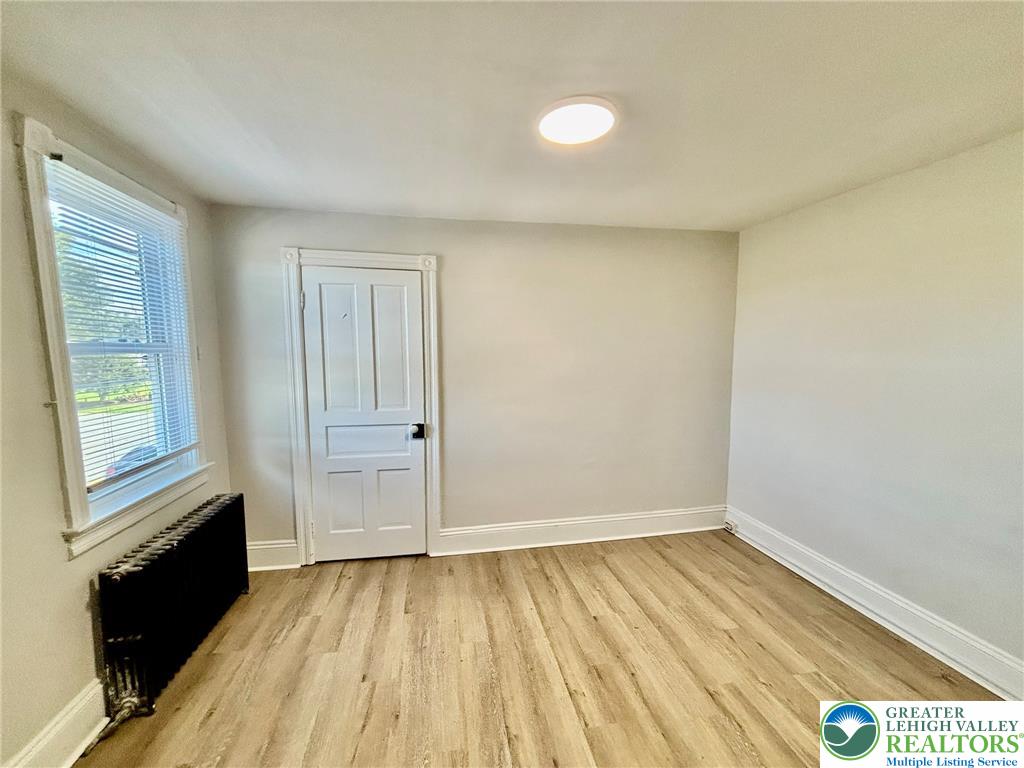 4067 Newburg Road Bethlehem, PA 18020 - Photo 15 of 19 Smooth wood-look flooring and classic trim elevate this versatile, light-filled interior space.