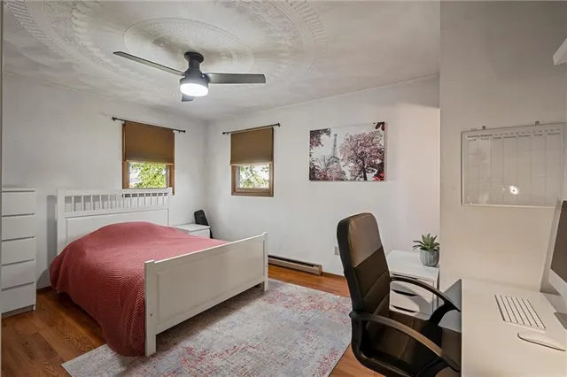 a bedroom with a bed and a chair