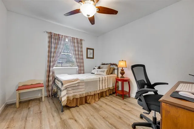 a bedroom with a bed and a couch