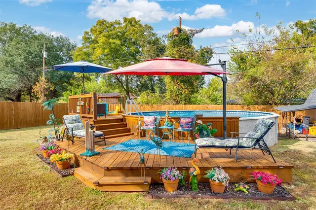 an outdoor space with pool and furniture