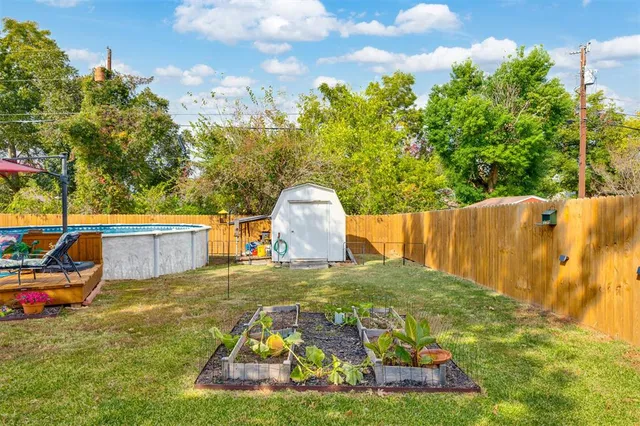a swimming pool with outdoor seating and yard