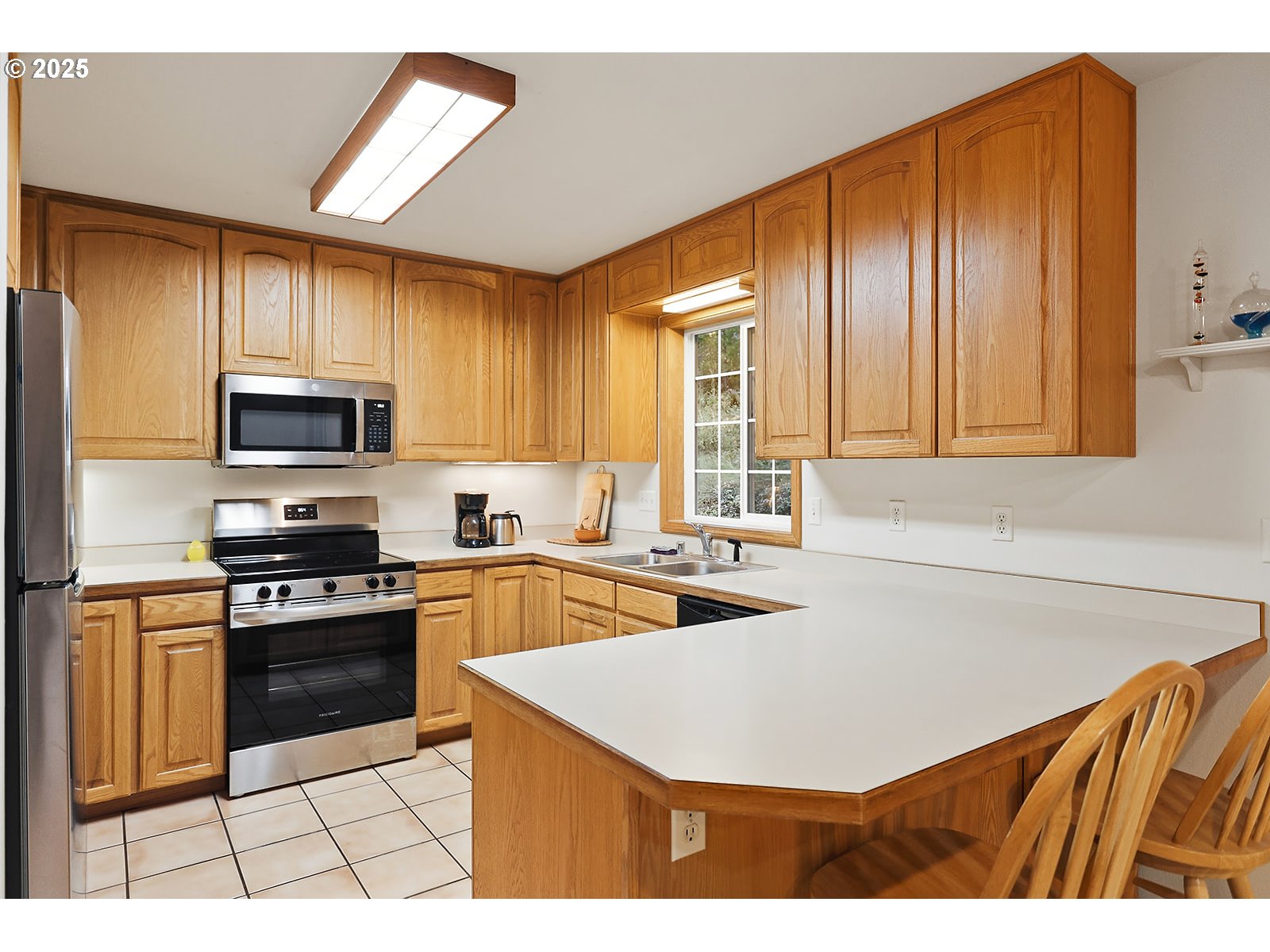 80 Echo Glen Road White Salmon, WA 98672 - Photo 12 of 48 a kitchen with stainless steel appliances granite countertop a sink dishwasher stove top oven and cabinets with wooden floor