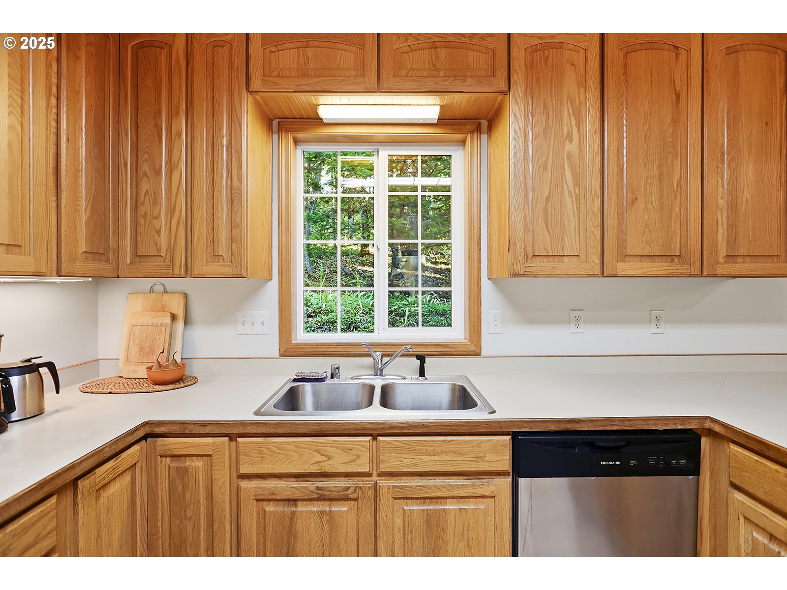 80 Echo Glen Road White Salmon, WA 98672 - Photo 13 of 48 a kitchen with stainless steel appliances a sink and cabinets