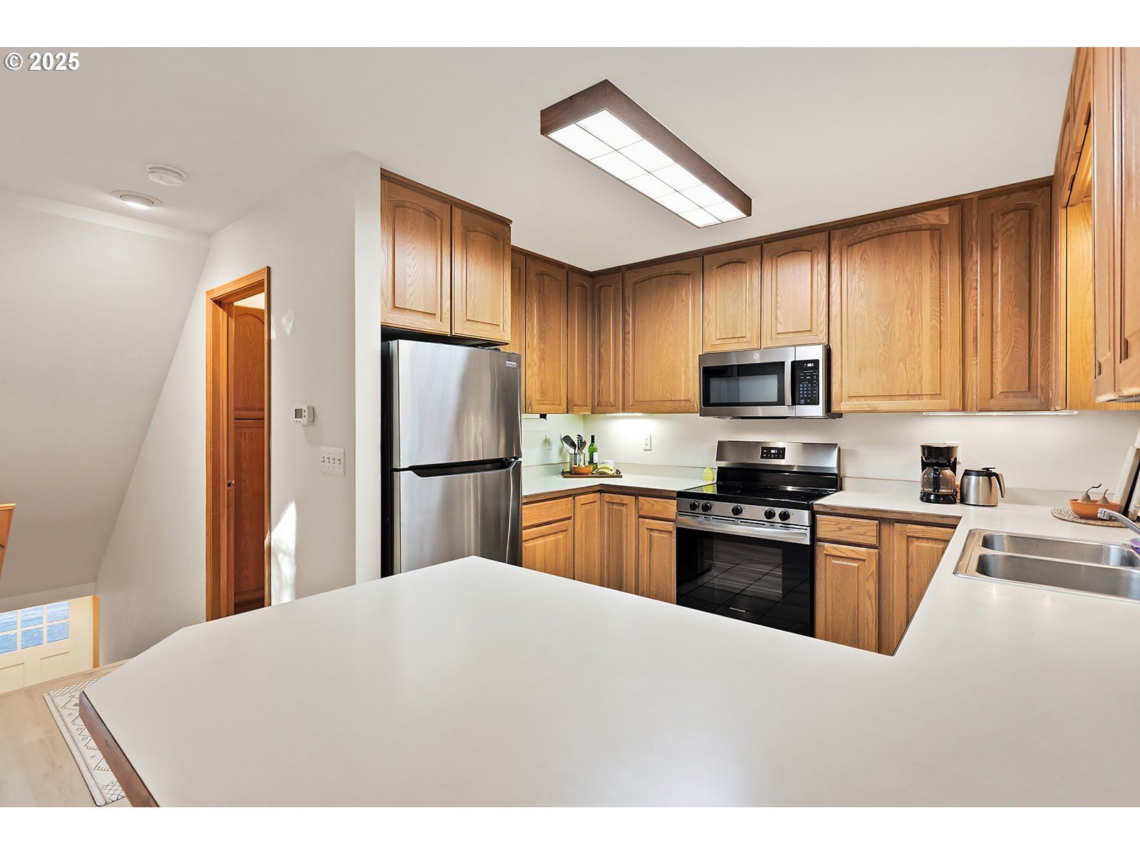 80 Echo Glen Road White Salmon, WA 98672 - Photo 14 of 48 a kitchen with stainless steel appliances granite countertop a refrigerator stove top oven a sink and dishwasher