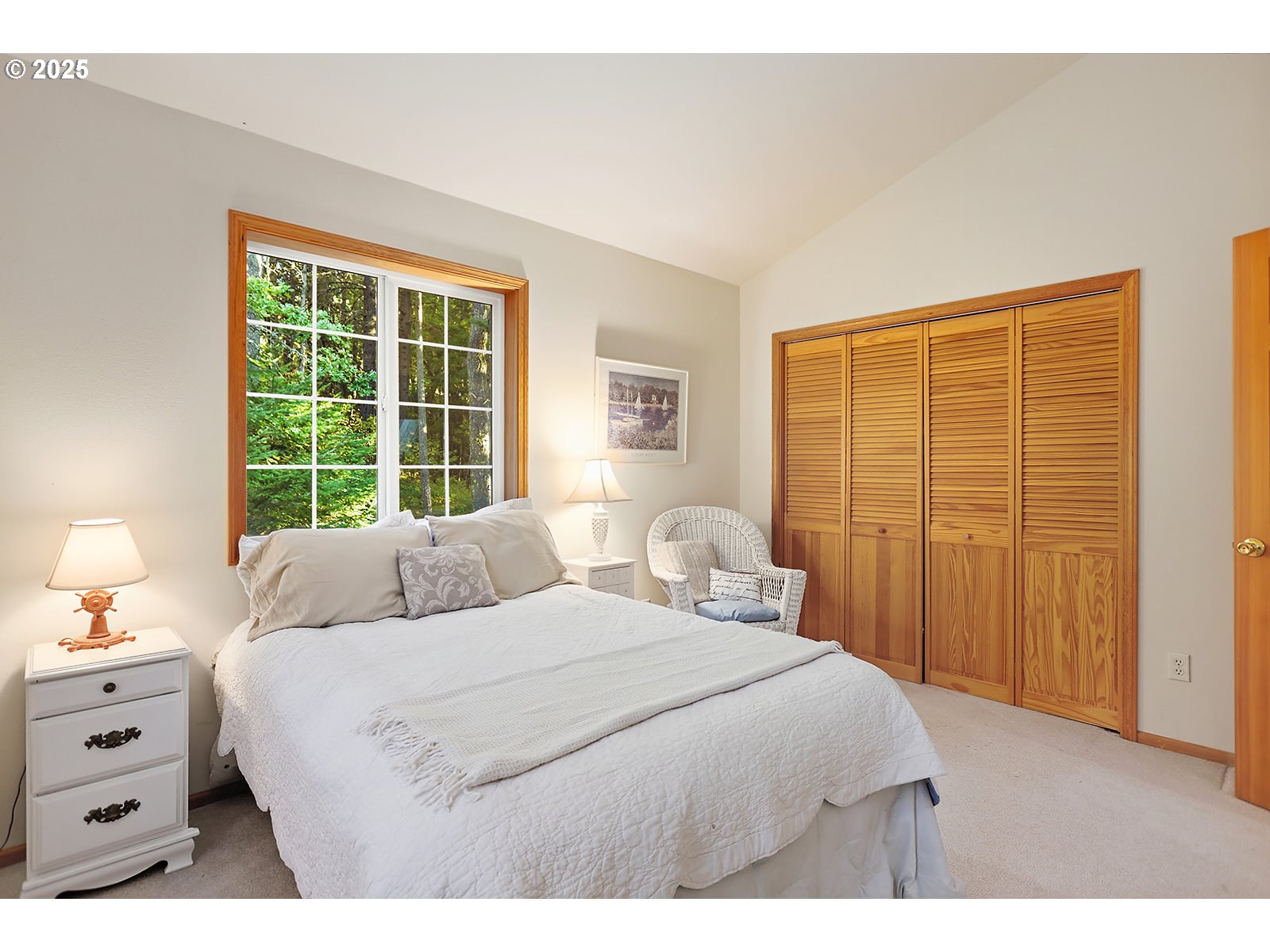 80 Echo Glen Road White Salmon, WA 98672 - Photo 23 of 48 a bedroom with a bed and a window