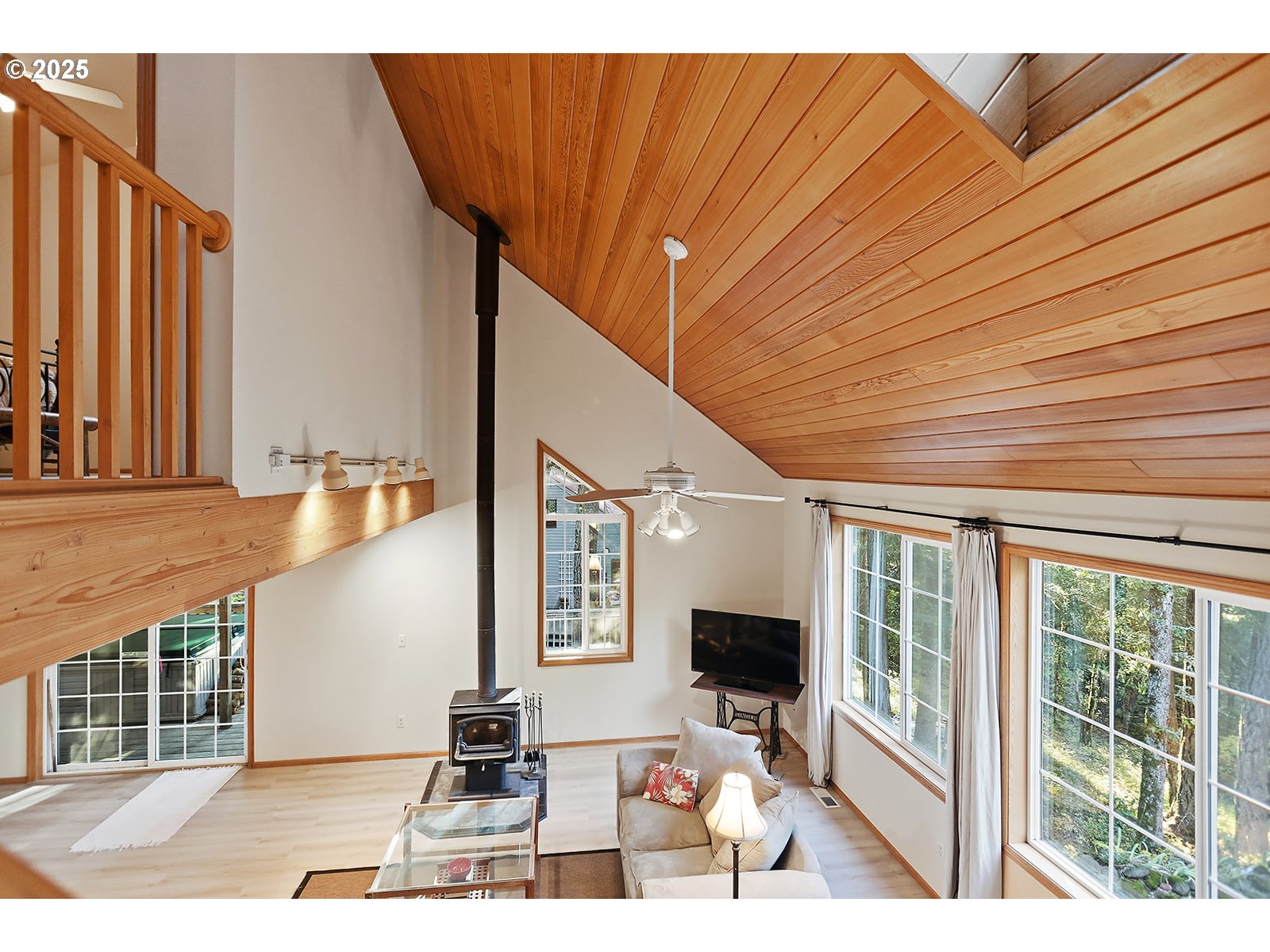 80 Echo Glen Road White Salmon, WA 98672 - Photo 25 of 48 a picture of a living room with a fireplace furniture and a large window