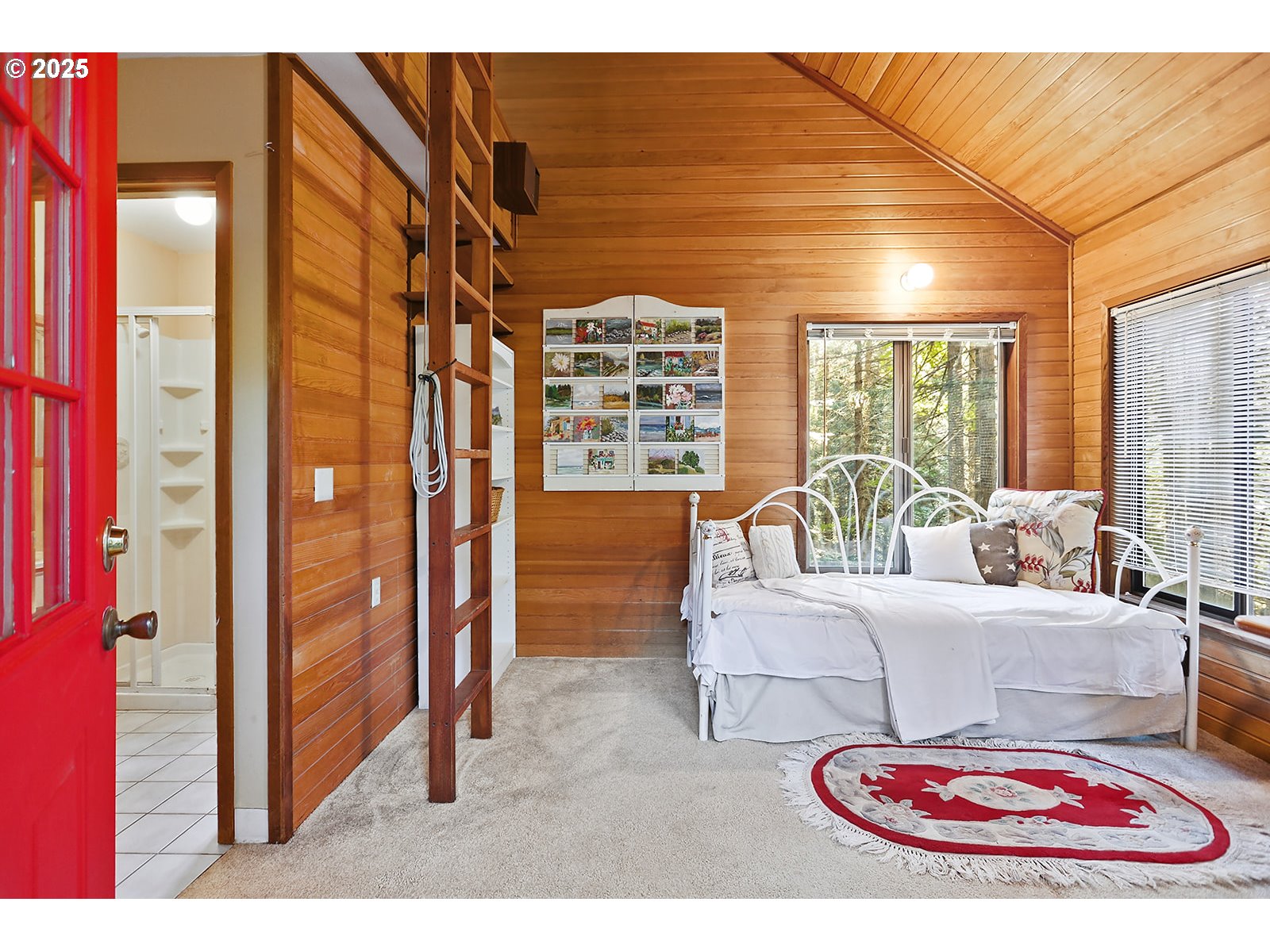 80 Echo Glen Road White Salmon, WA 98672 - Photo 36 of 48 a living room with furniture a large window and chandelier