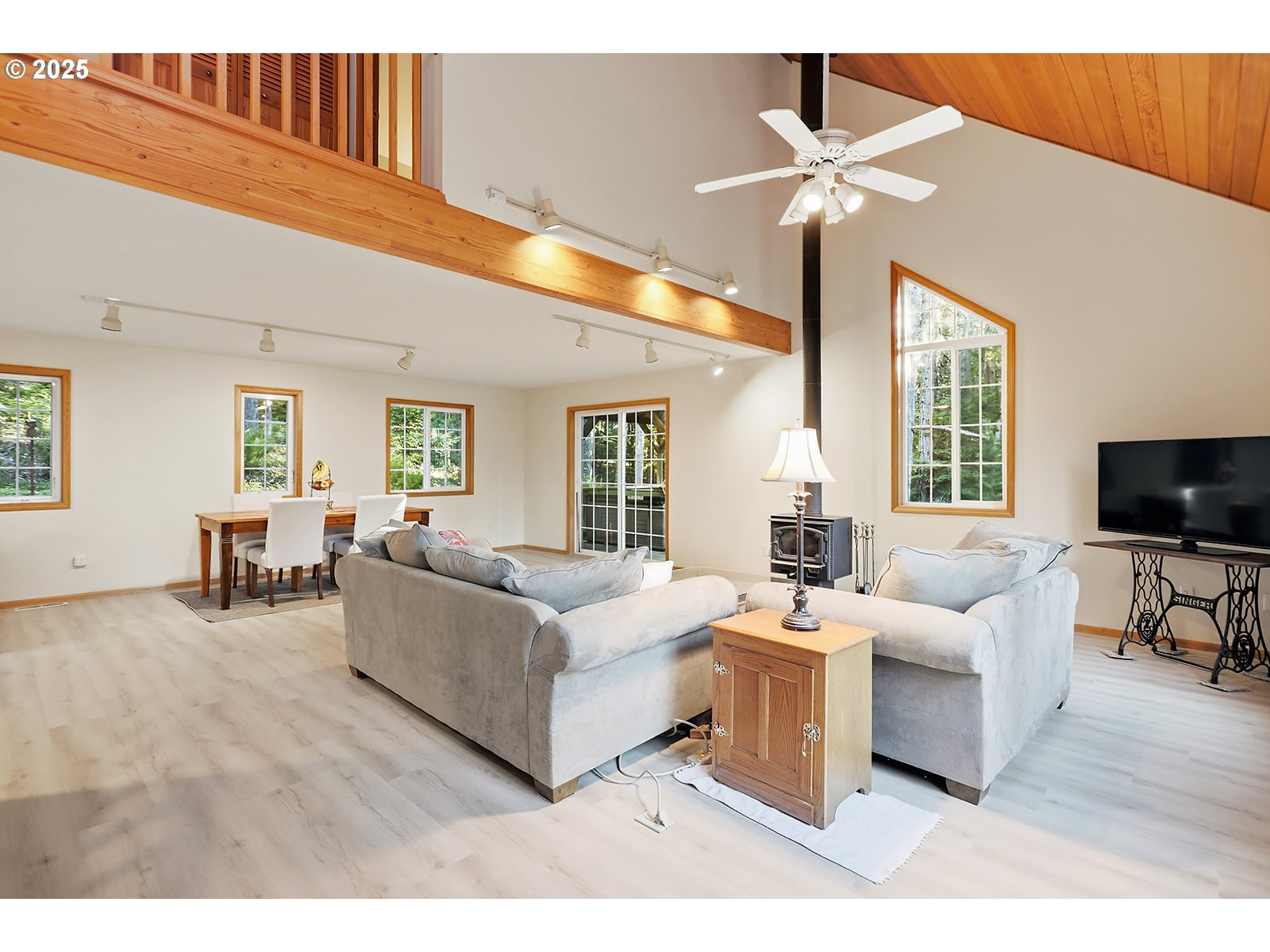 80 Echo Glen Road White Salmon, WA 98672 - Photo 7 of 48 a living room with furniture a flat screen tv and a large window