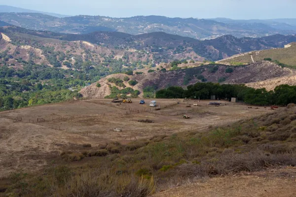 a view of a town with mountains in the background