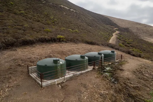 a view of a backyard with chairs