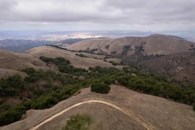 a view of a city with mountains in the background