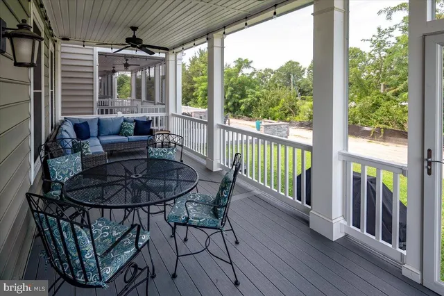 a bathroom with a granite countertop sink and a toilet
