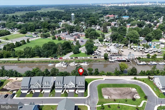 a bathroom with a granite countertop sink and a window