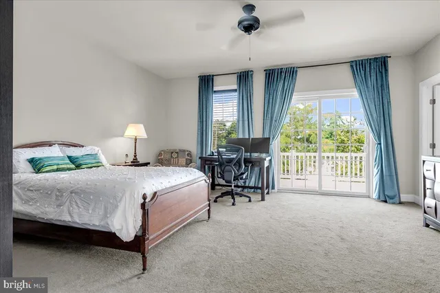 a spacious bathroom with a granite countertop sink a mirror and a