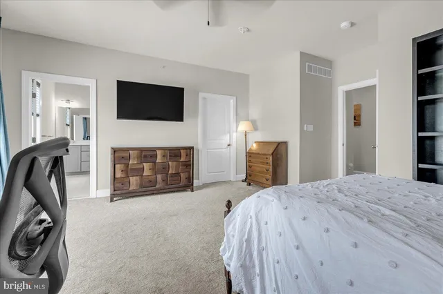 a view of a yard with plants and a bench in back yard