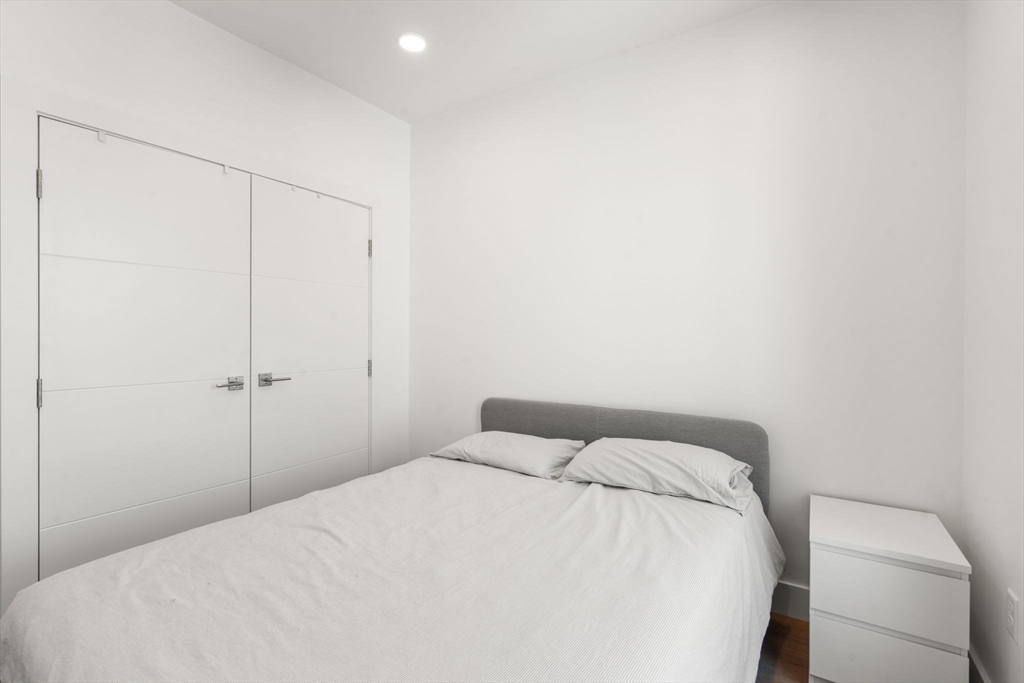 30 Penniman Road, Unit 506 Boston, MA 02134 - Photo 15 of 25 a bedroom with a bed and a closet