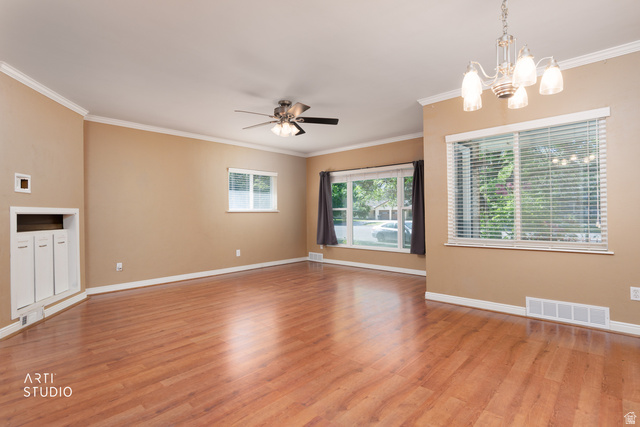 146 West 200 N Street Springville, UT 84663 - Photo 7 of 29 Spacious interior featuring wood-finish flooring, neutral wall tones, and white crown molding