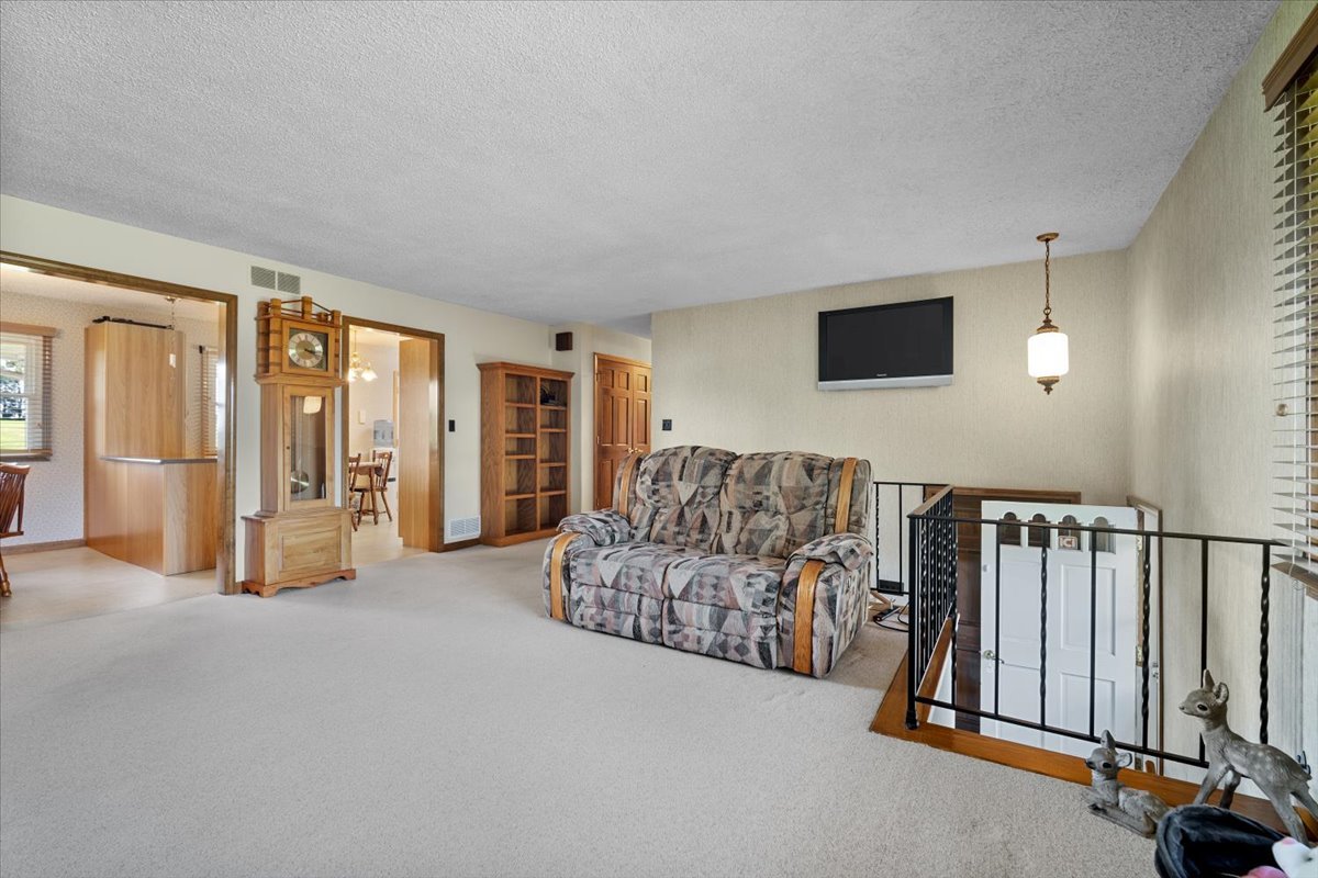 13310 Tango Road Bloomington, IL 61705 - Photo 13 of 40 a living room with furniture and large windows
