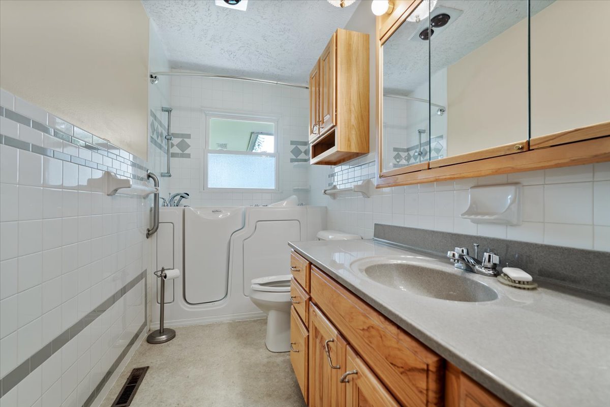 13310 Tango Road Bloomington, IL 61705 - Photo 14 of 40 a bathroom with a sink toilet and shower