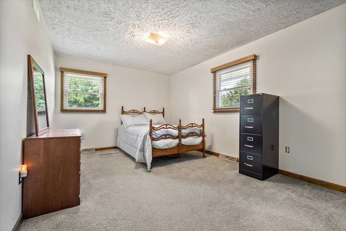 13310 Tango Road Bloomington, IL 61705 - Photo 17 of 40 a bedroom with furniture and a window