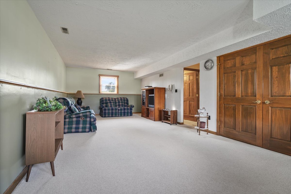 13310 Tango Road Bloomington, IL 61705 - Photo 22 of 40 a view of livingroom with furniture and windows